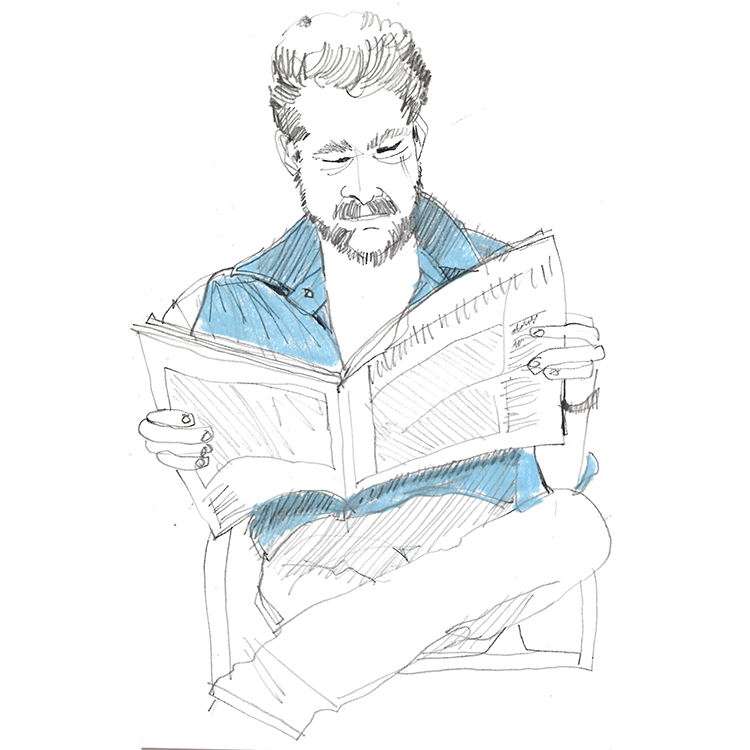 man reading paper working a four-day week